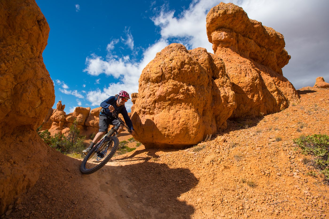 Mountain biker riding among the red rock formations of Thunder Mountain, Utah